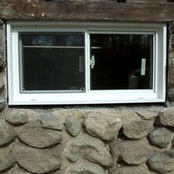 An energy efficient double-paned window installed in a basement in Trumbull.