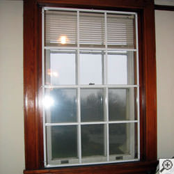 Advanced Energy window panels installed on a basement window system in Norwich.